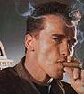 Ahnuld (1947-) smoking a cigar