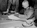 Field Marshal Wilhelm Keitel signing surrender document in Berlin on May 7, 1945